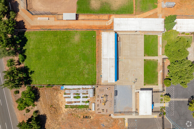Children love to play in the lush field at Pace Academy.