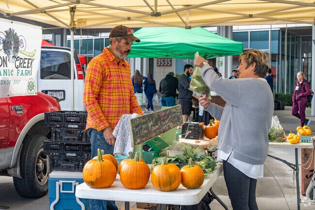 During summer months Farmers Market happens every Thursday in front of Riverside Hospital .