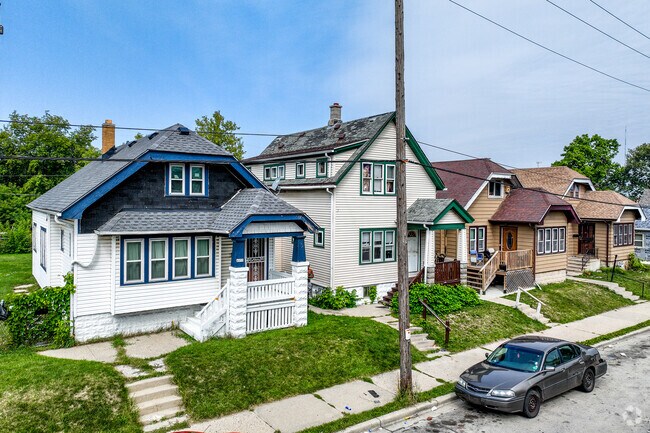 In Grover Heights, alley access leads to private garages behind homes.
