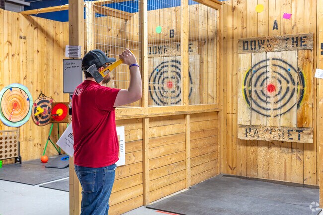 Boaz residents head to Down the Hatchet for a fun-filled experience, throwing axes and enjoying a great time with friends.