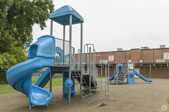 Cahaba Elementary School’s playground features slides, climbing bars, and see-saws.