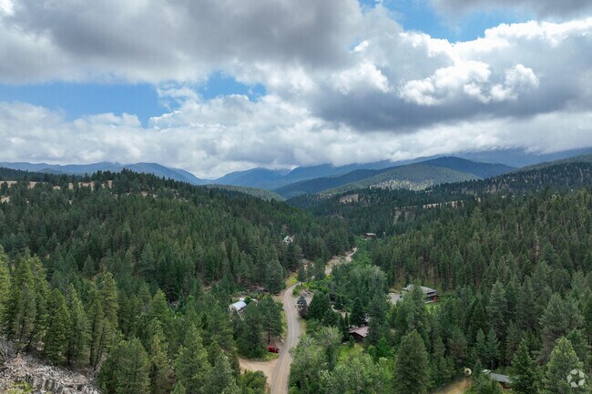 A scenic aerial view of Jefferson City's forested surroundings offers a glimpse of rural Montana