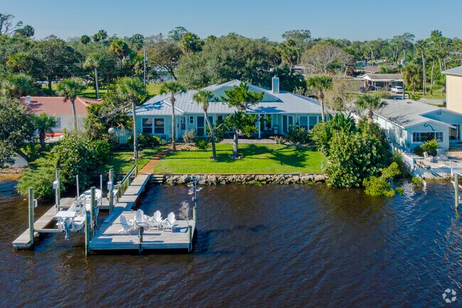 Catch a fish or launch your boat off your own dock at this spacious ranch in Harbor Oaks.