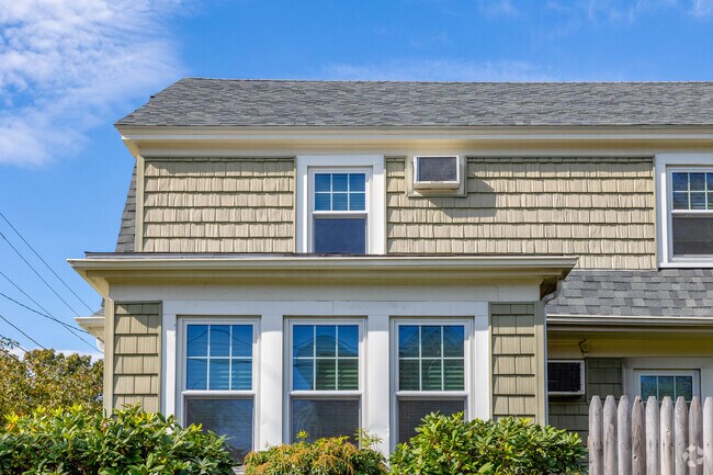 Dutch Colonial homes are noticeable with their angled roofs and shingled siding in Auburn.