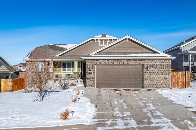 This Contemporary home in Gillette has a brick face and 2-car garage.