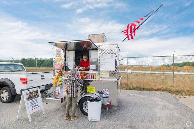 At Nashua Airport in Northwest Nashua, you can find this hot dog vendor selling fresh hot dogs.