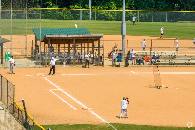 Residents of Closeburn-Glenkirk enjoy at softball game at Park Road Park.