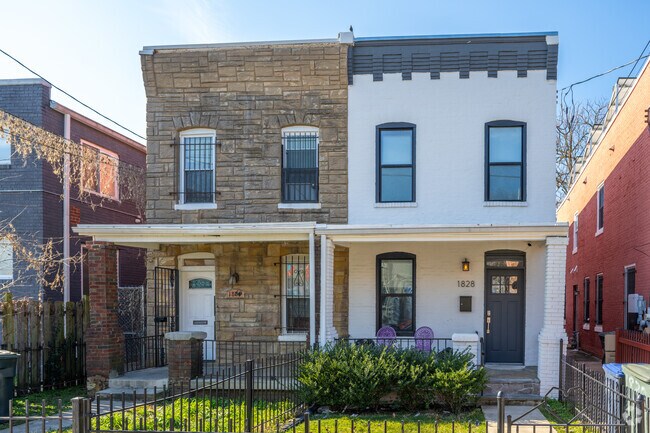 An old row home next to a newly refurbished row home on Kendall St NE in Ivy City.