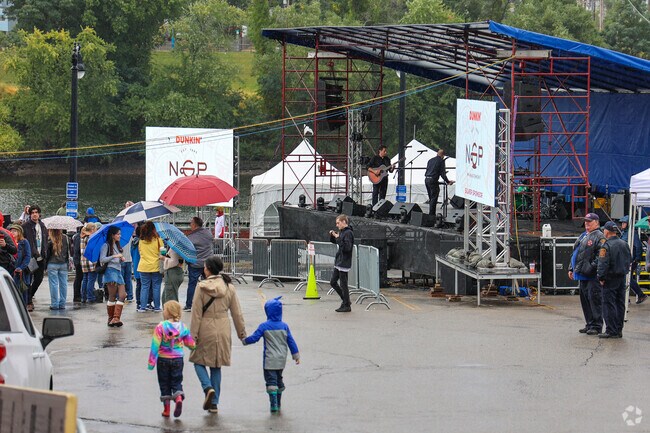 Friends meet up at the waterfront to watch the performances at Haverhill’s River Ruckus event.