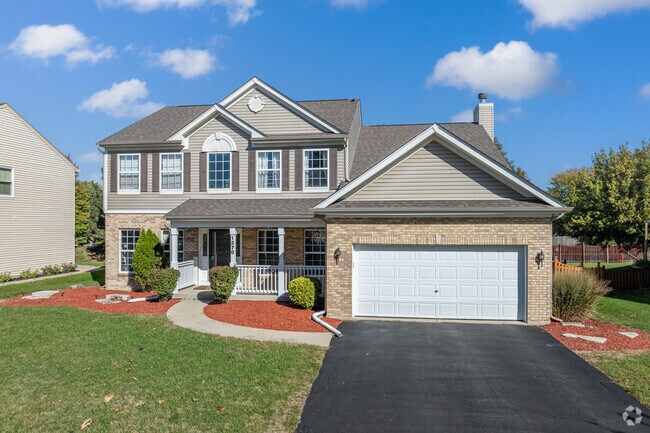 New traditional homes with attached garages dominate the community in Sunset Park-Old Plank.