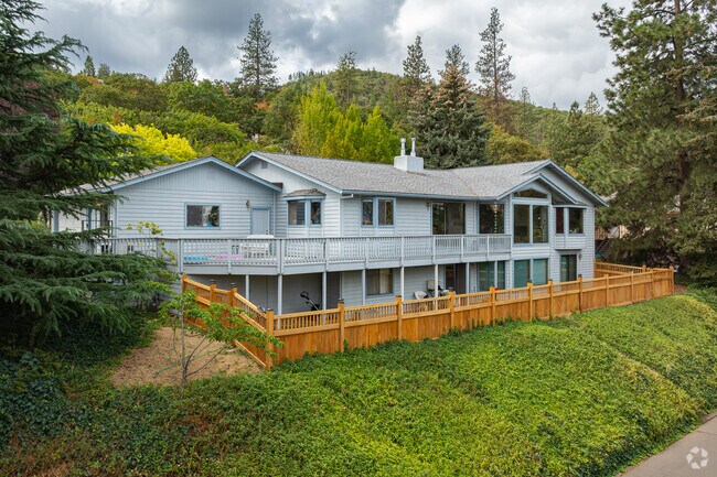 A large contemporary home sits along the hill overlooking the homes of South Ashland.