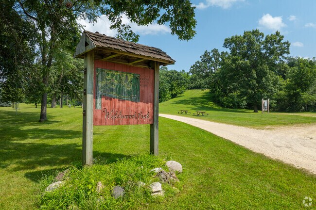 Wildwood Park features a number of amenities, including a sledding hill and picnic benches.