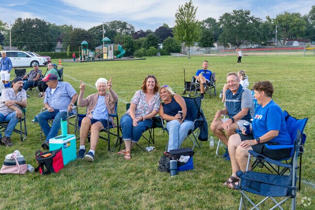 Families gather at School Yard Park in Union Grove for the Summer Music in the Park series.