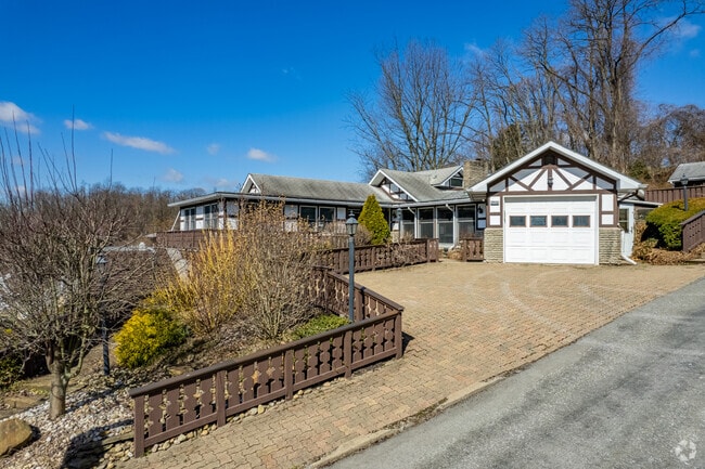 Many homes in the Port Vue neighborhood have landscaped yards.