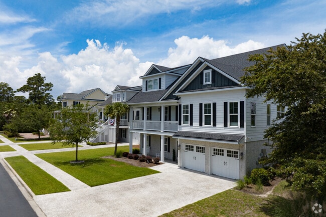 A two-story newly constructed home on Wilmington Island features an attached garage.
