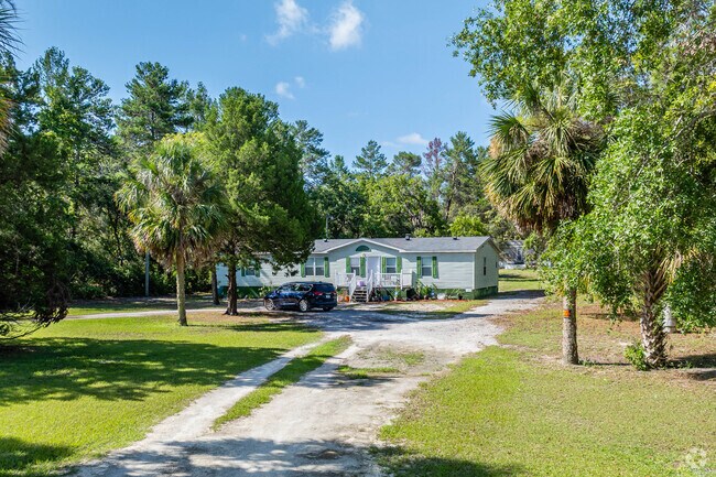 A ranch-style home in Gulf Coast Acres on a large lot combines spacious single-story living with ample outdoor land-ideal for privacy and outdoor activities.