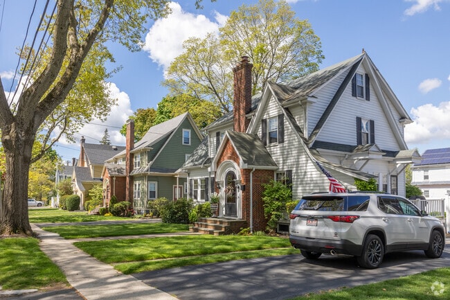 Brilliant foliage provides shade for these homes in West Quincy.