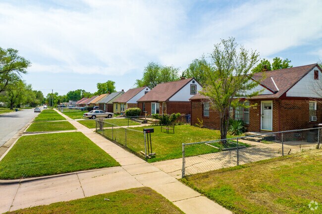 Row of red brick national-styled homes in Power.