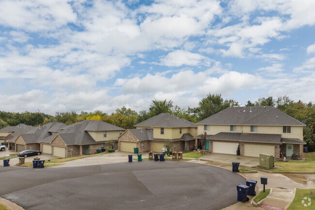 Winding roads lead to elegant homes nestled in The Oaks.
