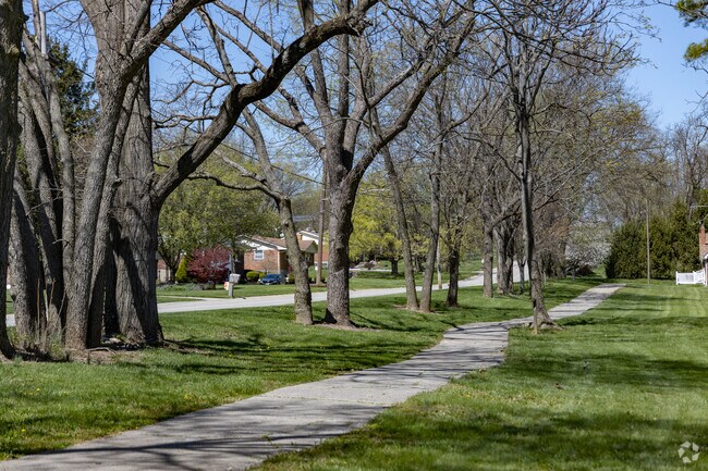 The Griffin Family Nature Preserve's tree-lined walking trail is popular among joggers.