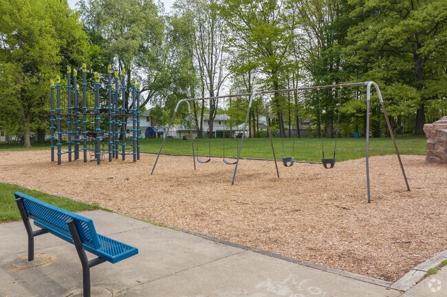 Ingham Park in Averill Woods, Lansing, offers amenities for locals, including swings and an open field.