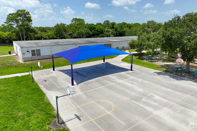 Outdoor activities at Lewis Carroll Elementary School are covered for hot days.