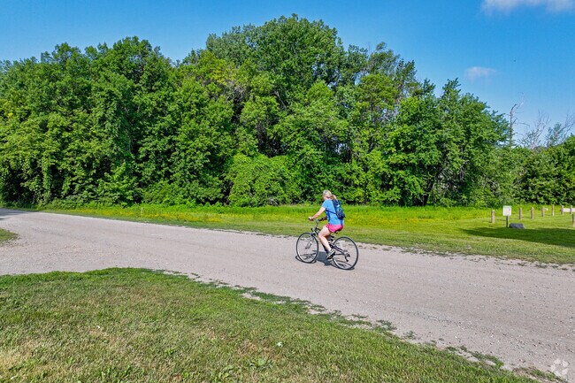 Cycle paved or rustic trails at Lake Rebecca Park Reserve.