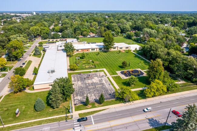 Hillis Elementary School is surround by trees and greenery in Merle Hay.