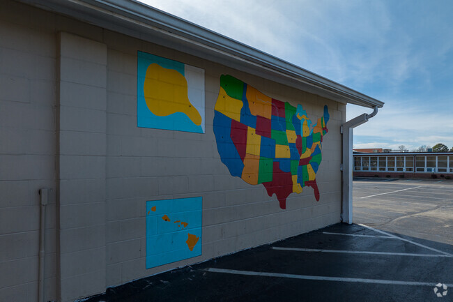Assumption School mixes learning with recess with the paintings in the parking lot.