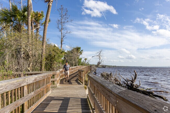 Walk the boardwalks along the Trout River in Charter Point.