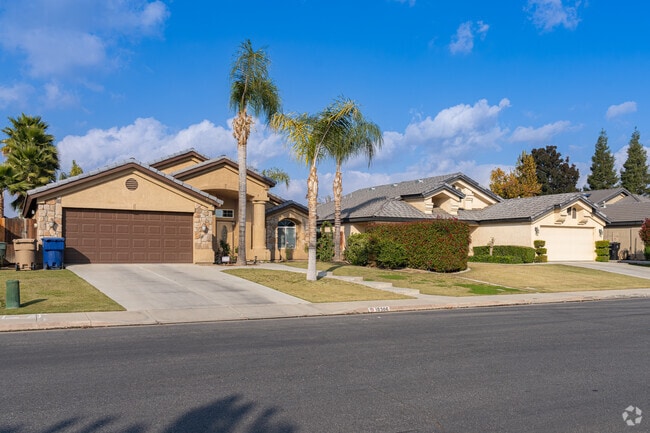 Many homes of Terra Vista have moderately sized yards with palm trees.