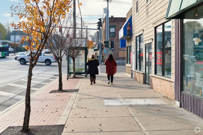 Friends walking in downtown Oswego.