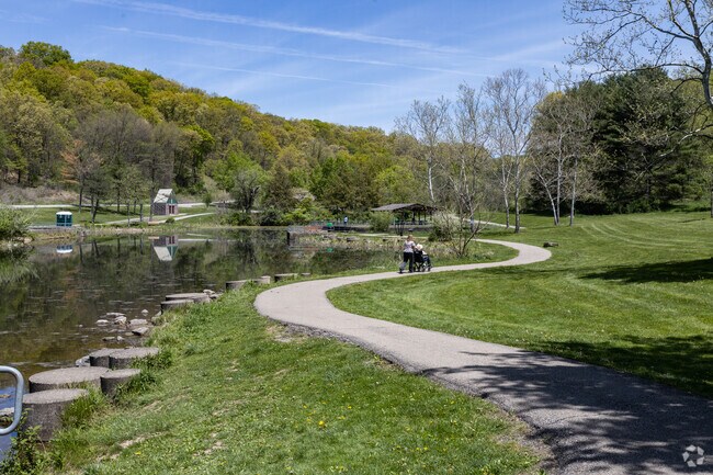 Go for a stroll with loved ones on paved paths at Deer Lakes Park near Curtisville.