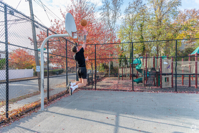 A resident of Southeast Yonkers dunks at the basketball court in Bregano Park.