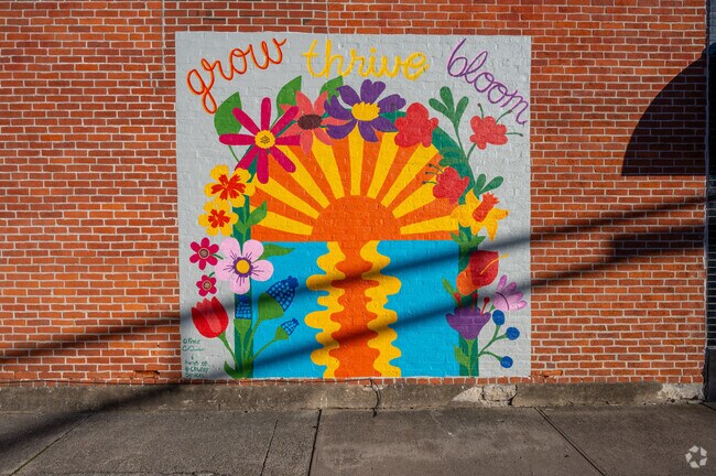 This Bluffton mural by O. Perez ads a pop of color to this downtown alley.