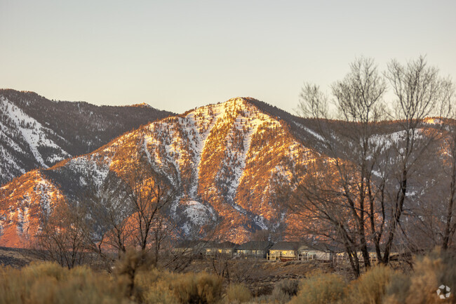 Snow-dusted peaks frame Carson City's stunning landscapes at golden hour.