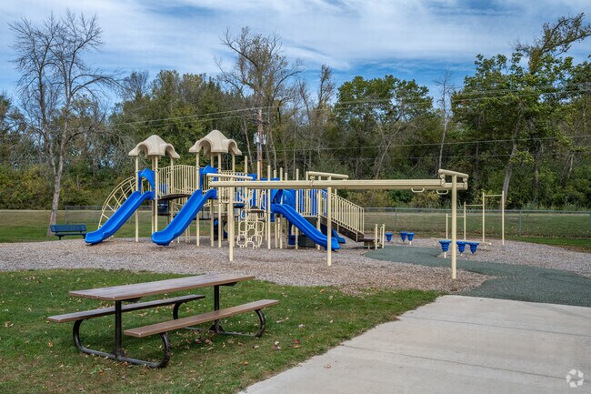 Families enjoy the playground at Riverview Park.