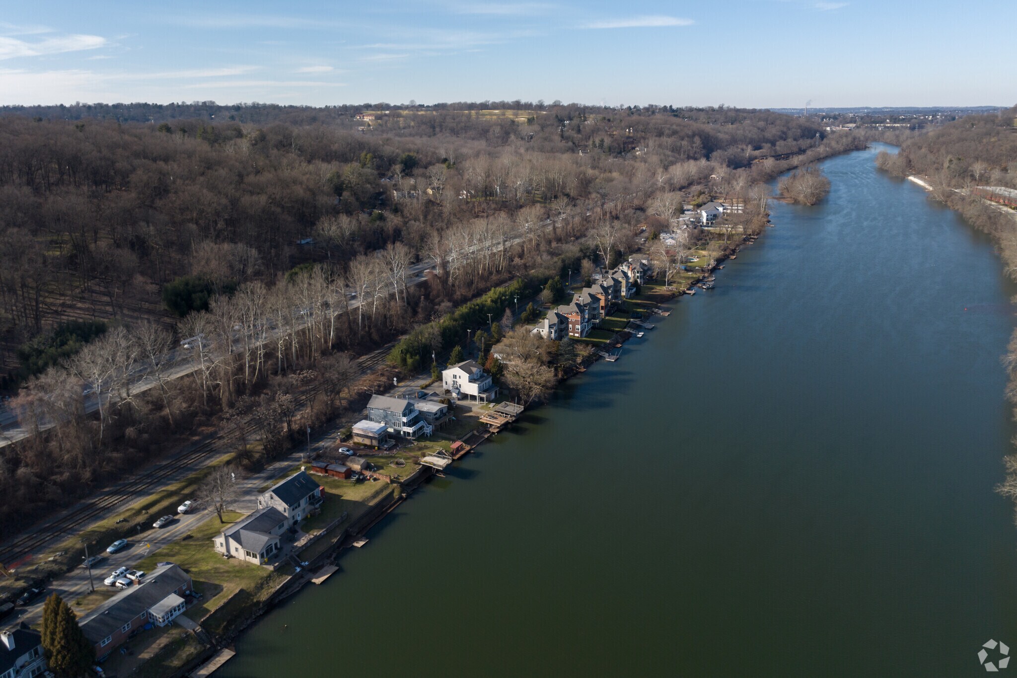 Dwellings line the Schuylkill River, embracing serene waterside living.