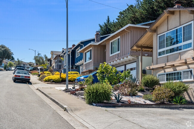 Quiet streets and lush greenery provide a peaceful suburban escape in Portola Highlands.
