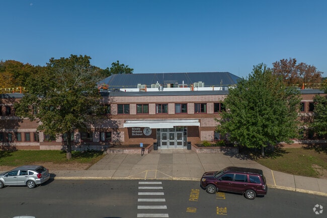 A crosswalk safely guides students to the entrance of Slade Middle School in New Britain.