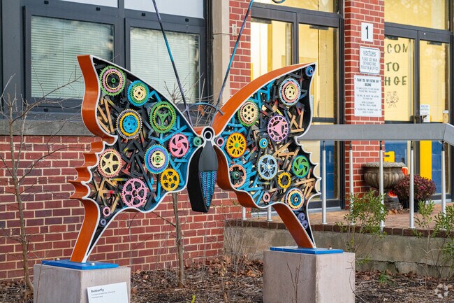 A metal sculpture of a butterfly welcomes students into H.H. Garnett Elementary School.
