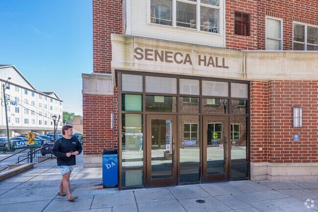 A student heads into Seneca Hall on the WVU campus in Wiles Hill-Highland Park.