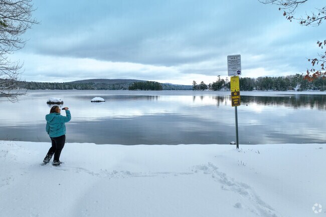 Brewer Lake in Orrington, Maine is a calm, clear freshwater lake surrounded by forested shoreline and peaceful rural scenery.
