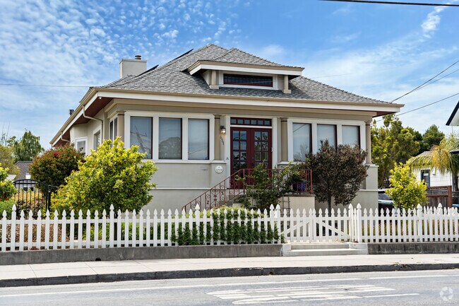Upper Seabright's classic bungalow with a white picket fence and garden embodies timeless appeal