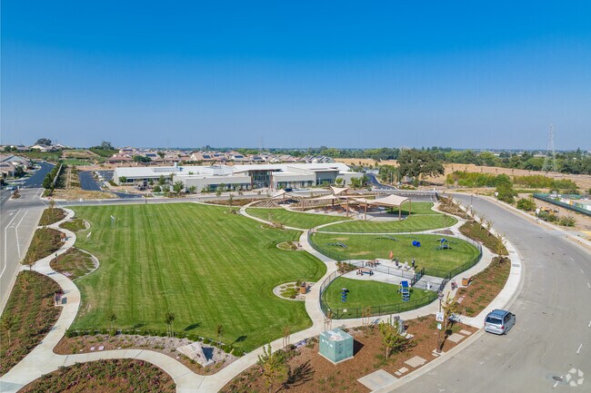 Enjoy a huge field, dog park auditorium and basketball court  at Pioneer Park Deer Ridge-Marsh.