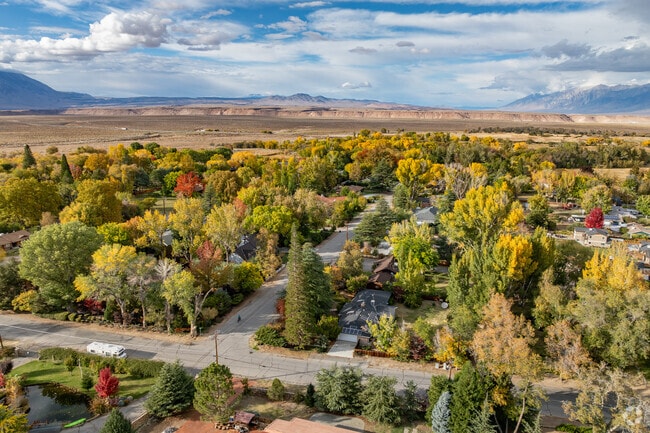 Fall colors in Dixon Lane-Meadow Creek pop off the desert mesa in the distance.