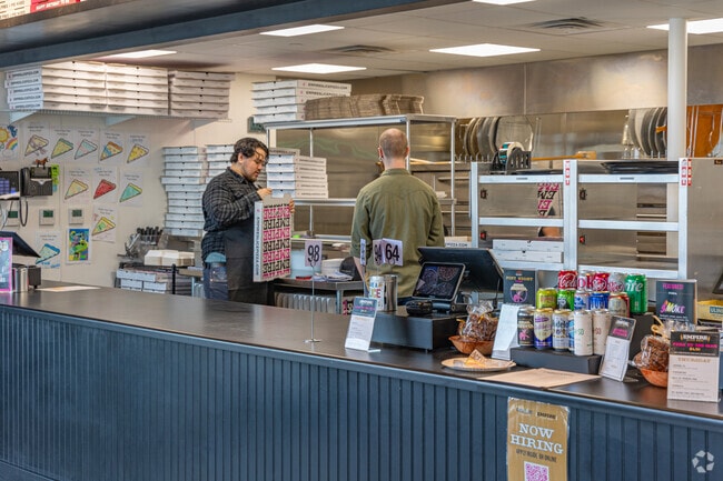 Grab a slice of pizza at Empire Slice in Mayfair West.