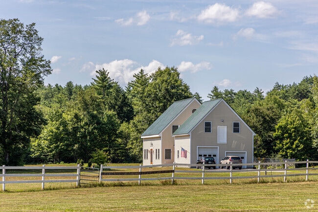 Homes in Sanbornton sit on acres with white fences and surrounding greenery.