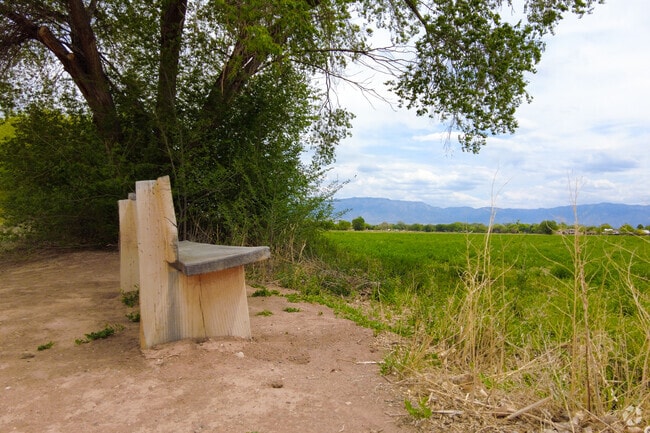 Residents can sit and overlook a field at Los Poblanos Open Space near Rio Grande Boulevard.