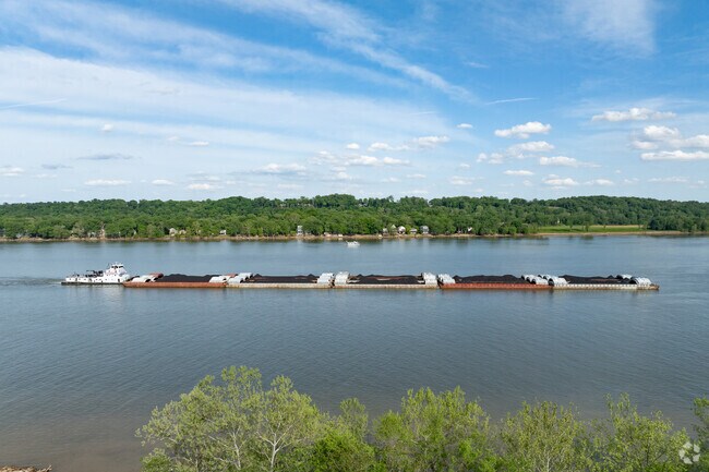 The Ohio River is located near Charlestown, with river traffic providing visual scenery.